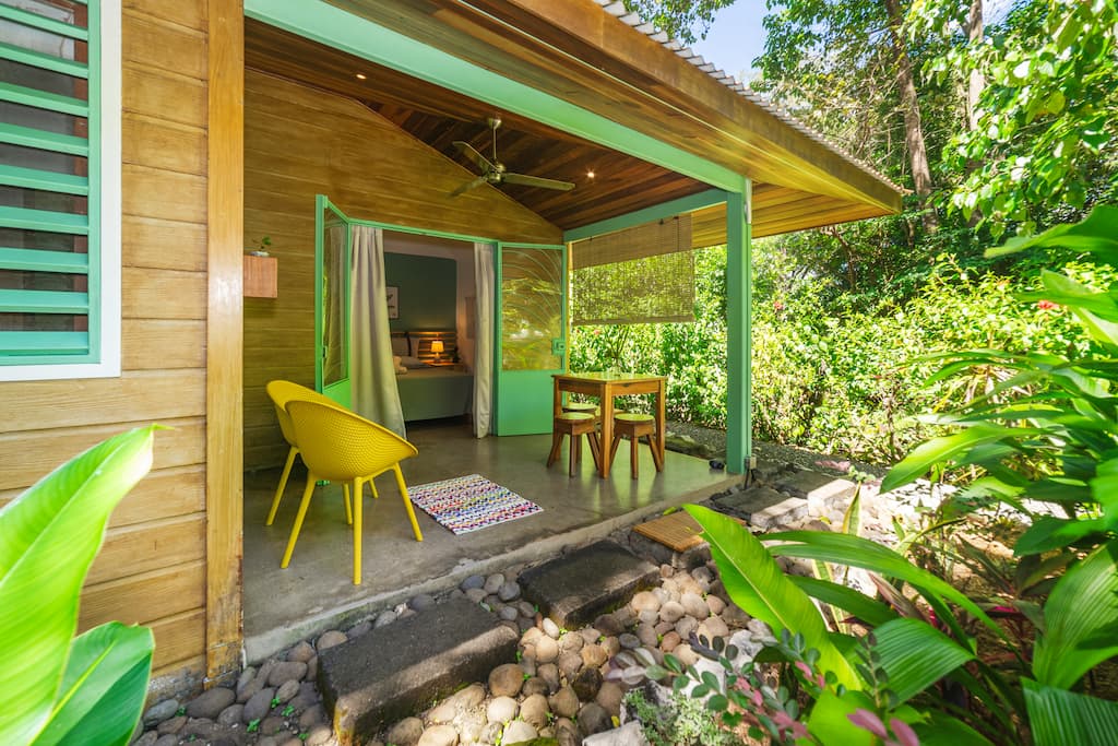 The patio and hibiscus of Cabina Agua